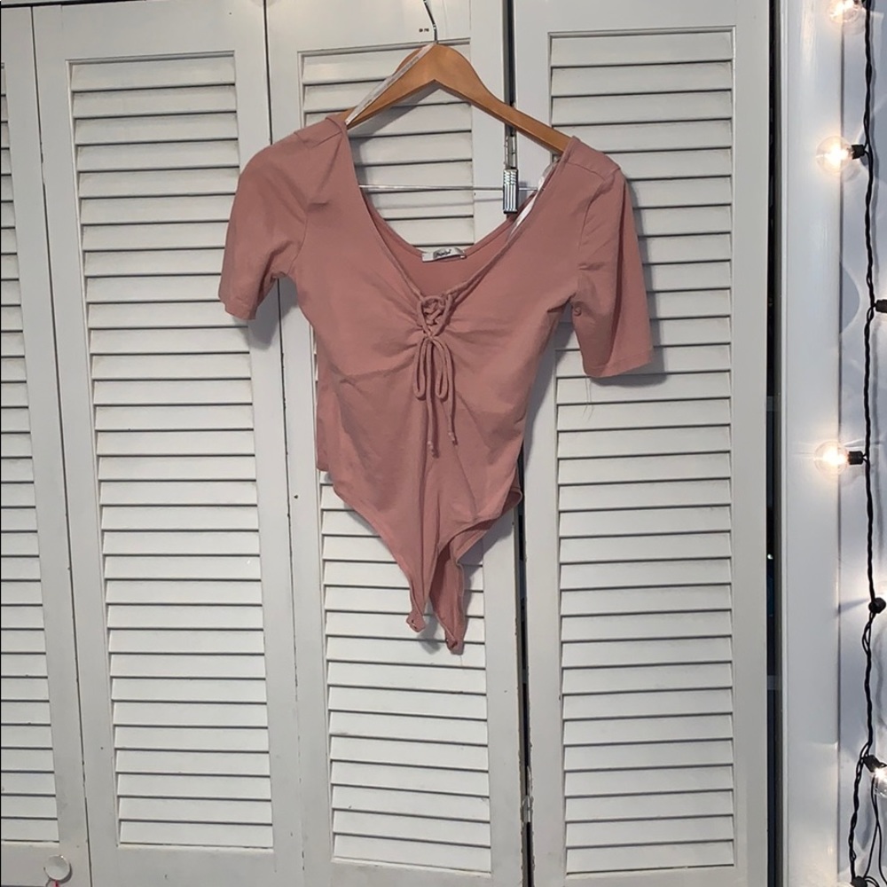 Light pink bodysuit.